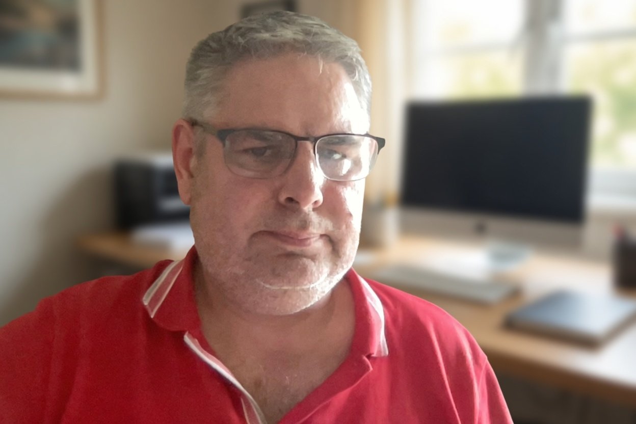 Markus, founder of OptimisedLead, at his desk